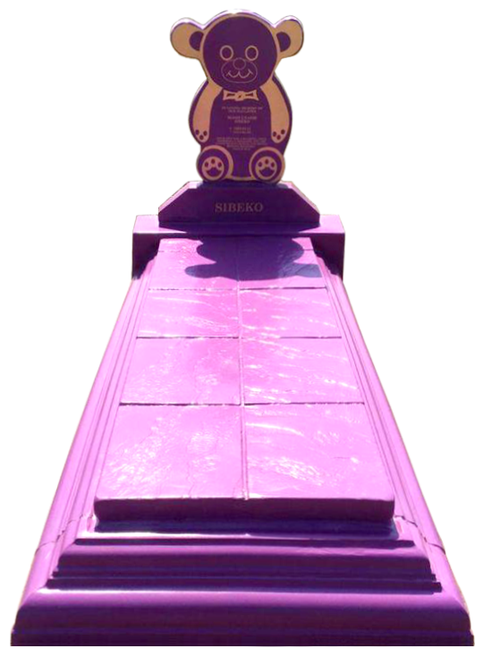 Royal Tombstones representation of the Teddy Bear Headstone with a tiled slab, painted in purple with gold details.